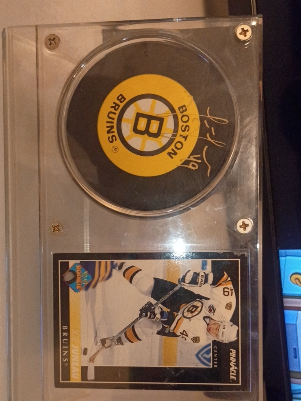 Boston Bruins Autographed Puck Display with Rookie Card - Black & Yellow.